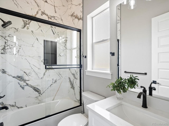 62101 E 32nd Ct, Strasburg, CO 80136 - full bathroom featuring vanity, toilet, and enclosed tub / shower combo