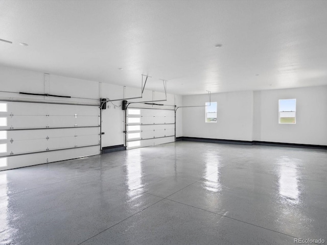 62101 E 32nd Ct, Strasburg, CO 80136 - garage with baseboards