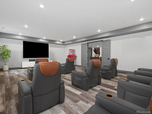 62101 E 32nd Ct, Strasburg, CO 80136 - cinema with light wood-type flooring, baseboards, and recessed lighting