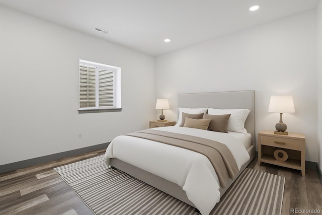 62101 E 32nd Ct, Strasburg, CO 80136 - bedroom with wood finished floors, recessed lighting, and baseboards
