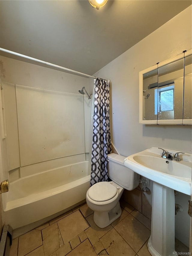 full bath featuring tile patterned floors, shower / bath combination with curtain, and toilet