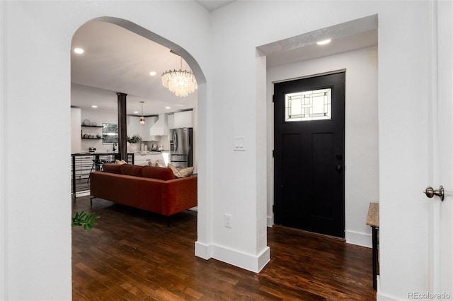 entrance foyer featuring dark hardwood / wood-style floors