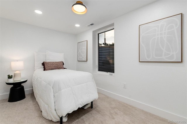 bedroom with light colored carpet