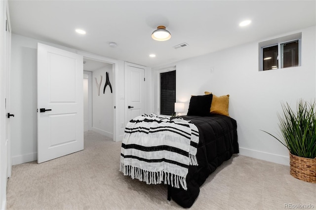 bedroom featuring light colored carpet