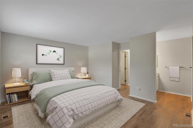 bedroom with hardwood / wood-style flooring