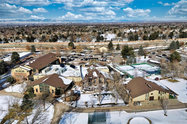 snowy aerial view featuring a mountain view