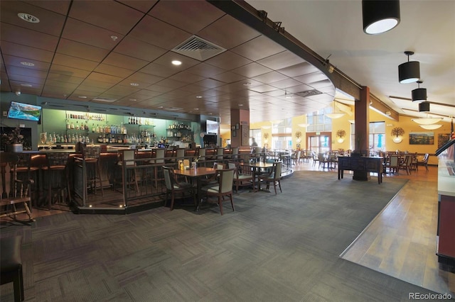 interior space with indoor bar and carpet floors