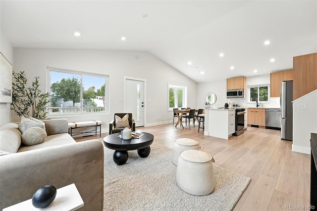 11635 W Security Ave, Lakewood, CO 80401 - living room with light wood-style flooring, recessed lighting, and lofted ceiling