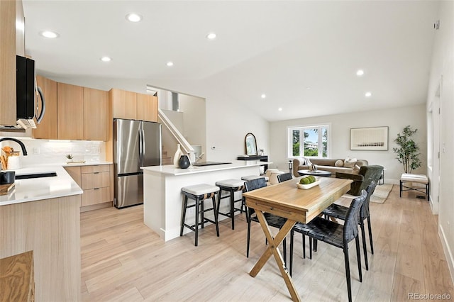 11635 W Security Ave, Lakewood, CO 80401 - dining space featuring light wood-style flooring, lofted ceiling, and recessed lighting