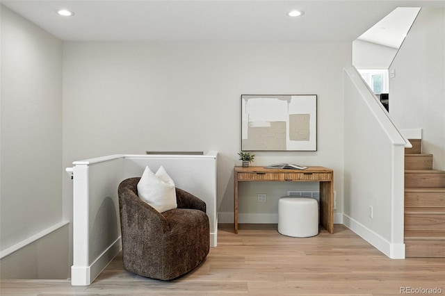 11635 W Security Ave, Lakewood, CO 80401 - living area featuring light wood finished floors, recessed lighting, and an upstairs landing