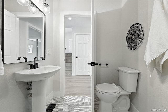 11635 W Security Ave, Lakewood, CO 80401 - bathroom featuring toilet and tile patterned flooring