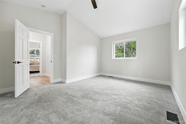 11635 W Security Ave, Lakewood, CO 80401 - spare room featuring carpet floors, lofted ceiling, and a ceiling fan