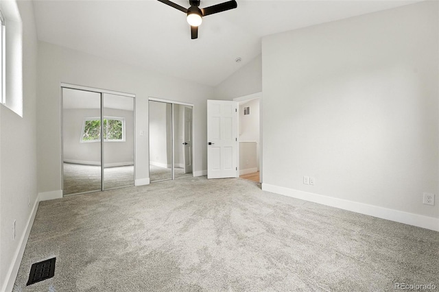11635 W Security Ave, Lakewood, CO 80401 - unfurnished bedroom with two closets, lofted ceiling, carpet floors, and a ceiling fan