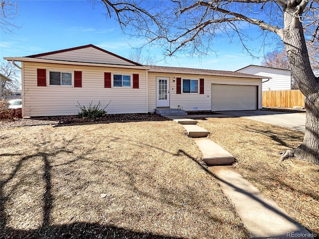 ranch-style house with a garage, fence, and concrete driveway