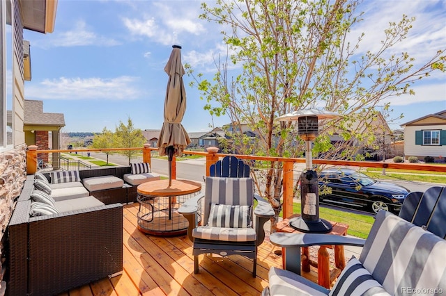 wooden deck featuring outdoor lounge area