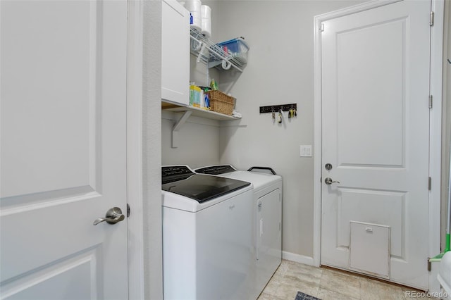 laundry room featuring separate washer and dryer and laundry area