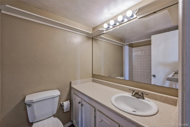 full bath featuring vanity, toilet, and a shower