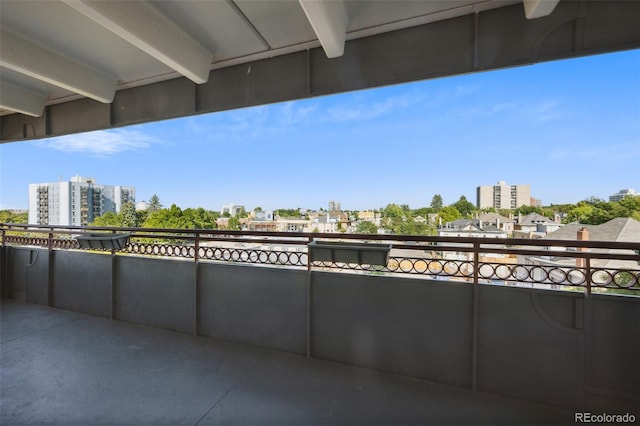 view of patio featuring a view of city and a balcony