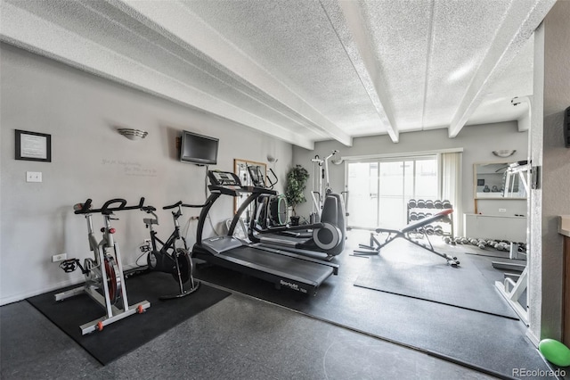 gym featuring a textured ceiling