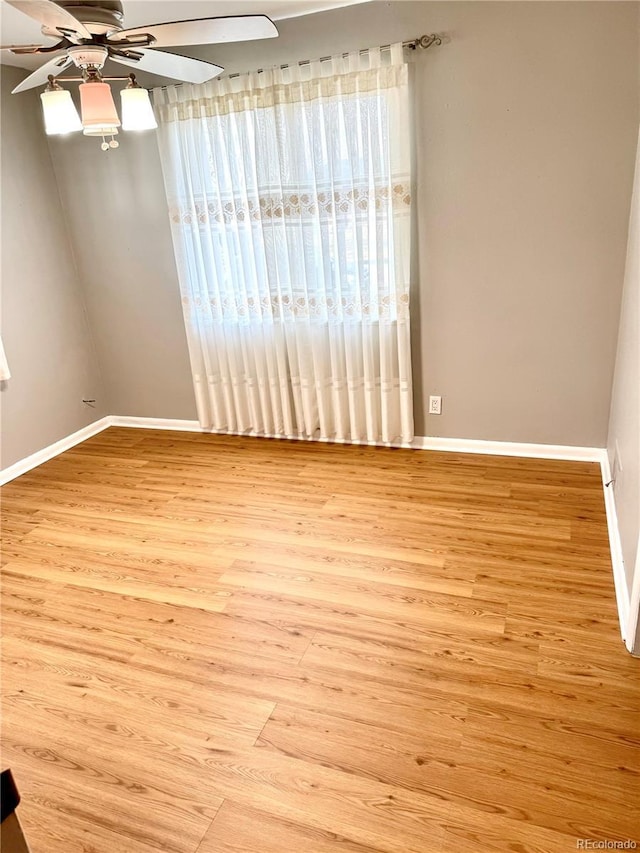 unfurnished room featuring ceiling fan and light wood-type flooring