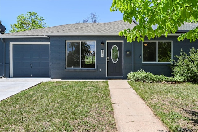 971 Ursula St, Aurora, CO 80011 - single story home featuring a garage, a front yard, brick siding, concrete driveway, and a shingled roof