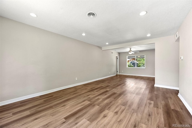 971 Ursula St, Aurora, CO 80011 - unfurnished room with ceiling fan, wood finished floors, baseboards, recessed lighting, and a textured ceiling