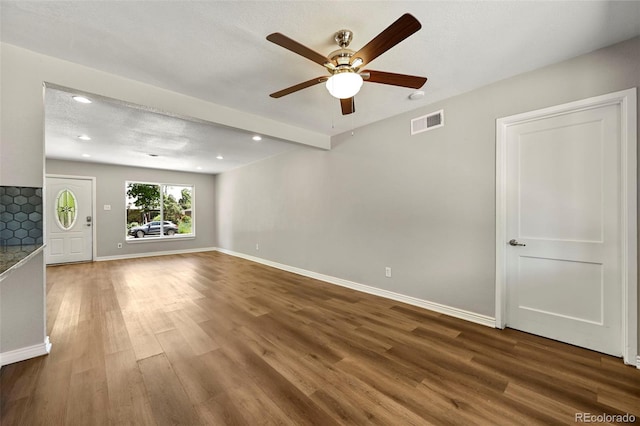 971 Ursula St, Aurora, CO 80011 - unfurnished living room with a ceiling fan, wood finished floors, recessed lighting, and baseboards