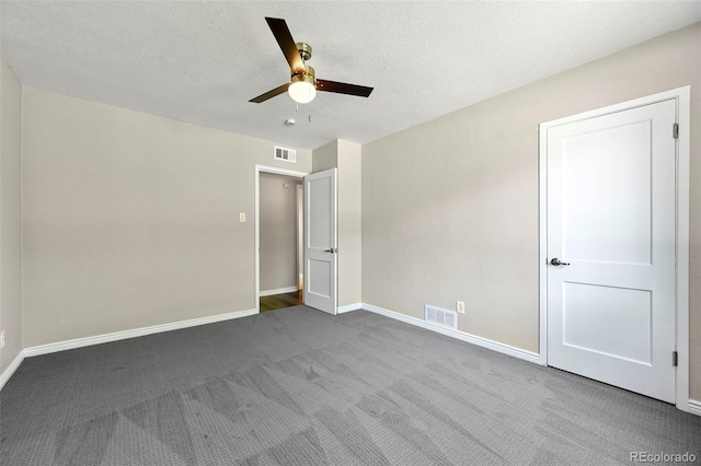 971 Ursula St, Aurora, CO 80011 - unfurnished bedroom with carpet, baseboards, a ceiling fan, and a textured ceiling