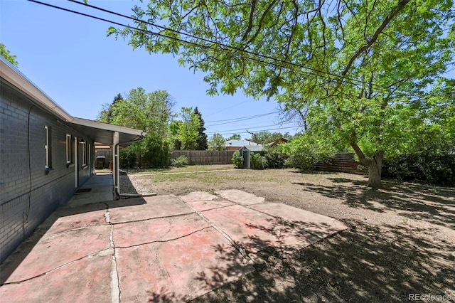 971 Ursula St, Aurora, CO 80011 - fenced backyard featuring a patio area