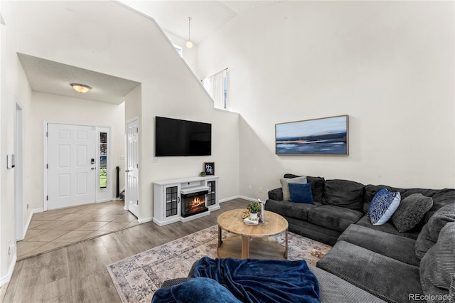 9630 Yukon Way, Colorado Springs, CO 80925 - living area with wood finished floors and a lit fireplace