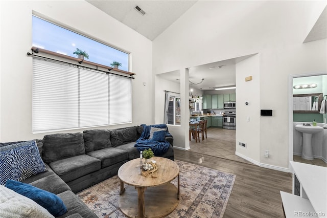 9630 Yukon Way, Colorado Springs, CO 80925 - living area with wood finished floors and high vaulted ceiling