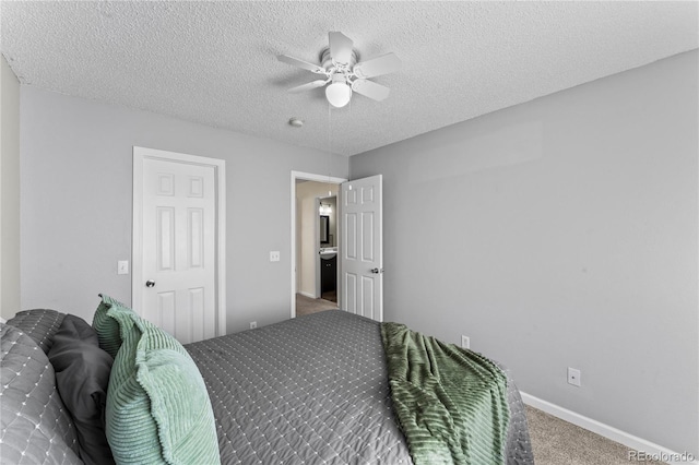 9630 Yukon Way, Colorado Springs, CO 80925 - carpeted bedroom with a textured ceiling and a ceiling fan