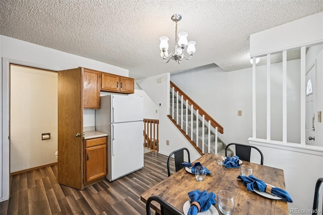 4220 Hunting Meadows Cir, Colorado Springs, CO 80916 - unfurnished dining area with dark wood-type flooring, a chandelier, stairway, and a textured ceiling