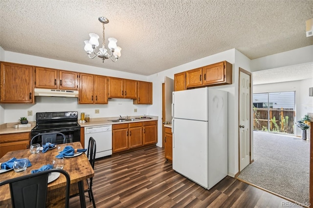 4220 Hunting Meadows Cir, Colorado Springs, CO 80916 - kitchen featuring white appliances, under cabinet range hood, brown cabinetry, dark wood finished floors, and a chandelier