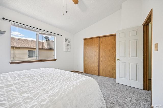 4220 Hunting Meadows Cir, Colorado Springs, CO 80916 - bedroom featuring carpet flooring, vaulted ceiling, a closet, a textured ceiling, and a ceiling fan