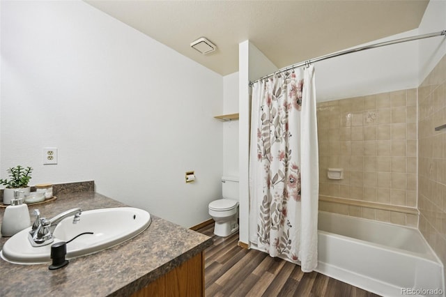4220 Hunting Meadows Cir, Colorado Springs, CO 80916 - bathroom with vanity, wood finished floors, and shower / tub combo