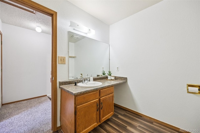 4220 Hunting Meadows Cir, Colorado Springs, CO 80916 - bathroom featuring vanity and baseboards