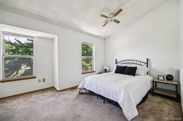 4220 Hunting Meadows Cir, Colorado Springs, CO 80916 - carpeted bedroom with a textured ceiling and a ceiling fan