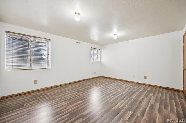 4220 Hunting Meadows Cir, Colorado Springs, CO 80916 - unfurnished room with wood finished floors and baseboards