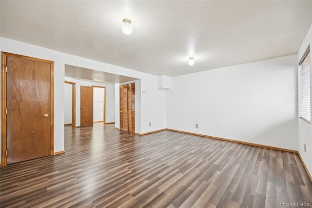 4220 Hunting Meadows Cir, Colorado Springs, CO 80916 - empty room with dark wood-style flooring
