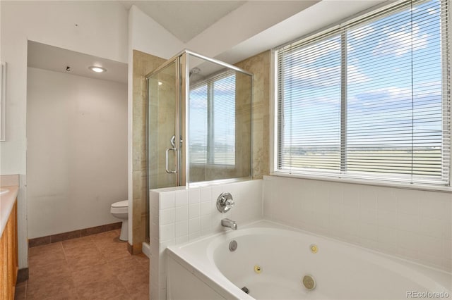 bathroom with toilet, a stall shower, a jetted tub, and vanity