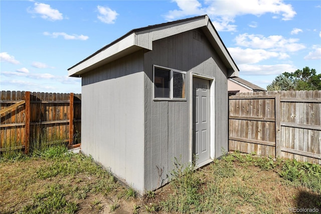 view of shed with a fenced backyard