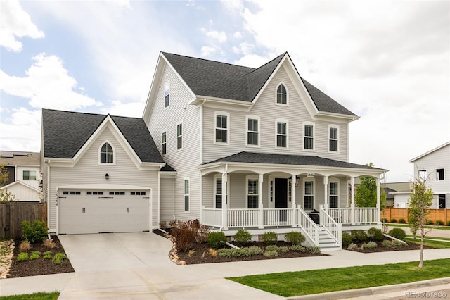 traditional-style home with a shingled roof, fence, covered porch, and driveway