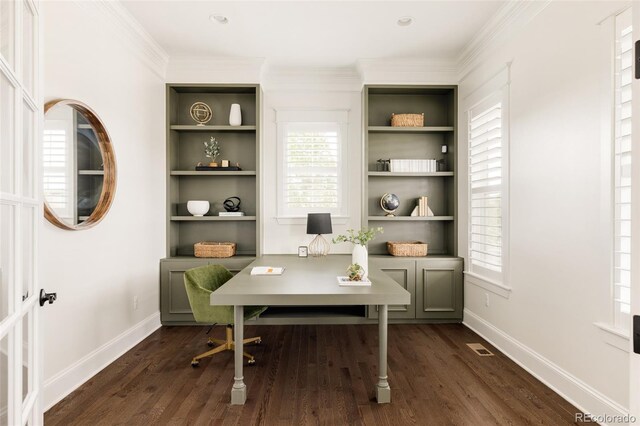 home office with visible vents, dark wood-style flooring, crown molding, and baseboards