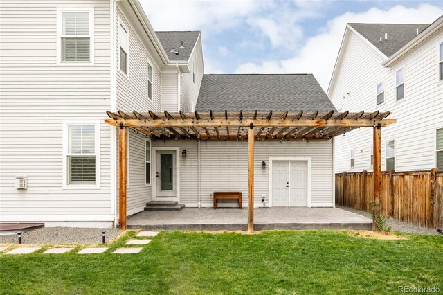 rear view of property with a pergola, fence, and a patio