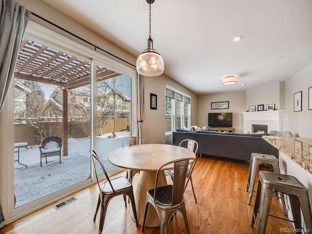 dining area featuring light wood-type flooring