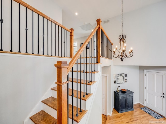 stairway with hardwood / wood-style floors