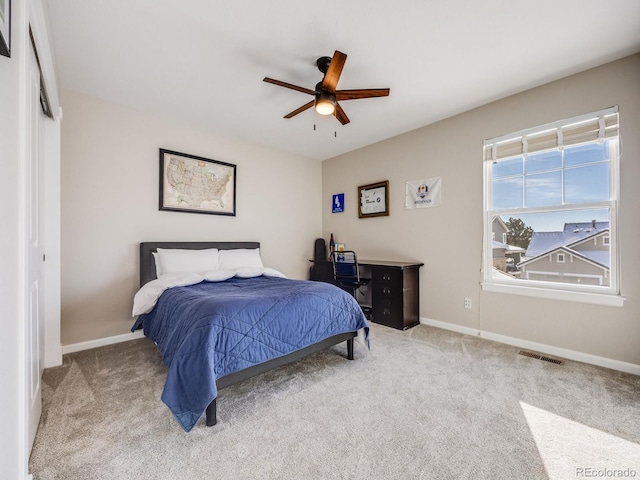 bedroom with ceiling fan and carpet flooring