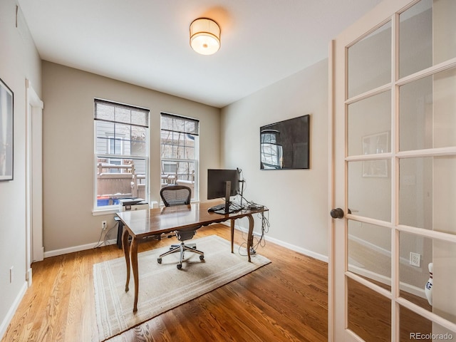 office space with light hardwood / wood-style flooring