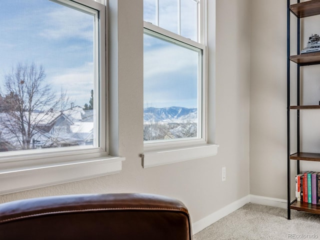 unfurnished room with a mountain view and a healthy amount of sunlight